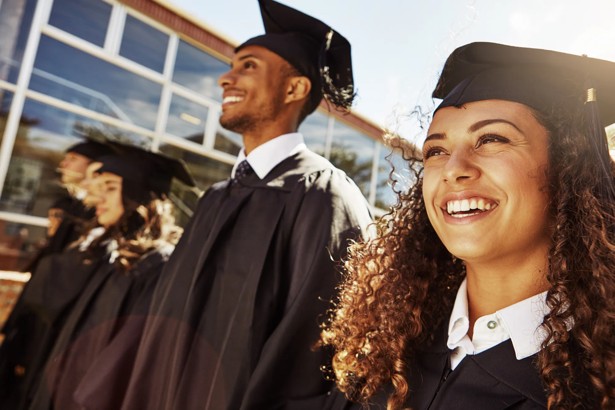 Students celebrating graduation on campus